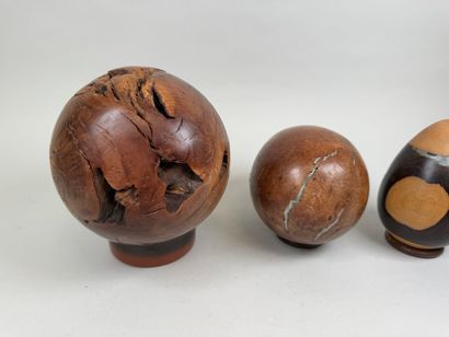 Three turned briar roots and egg-shaped metal...