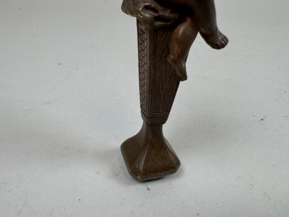 Bronze seal featuring a cherub mounted on...