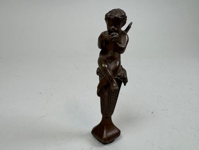 Bronze seal featuring a cherub mounted on...