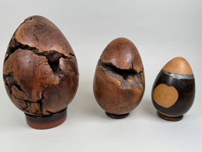 Three turned briar roots and egg-shaped metal...