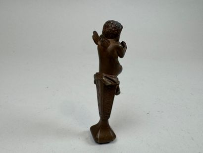 Bronze seal featuring a cherub mounted on...