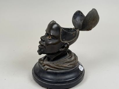 Bronze desk inkwell decorated with a man's...