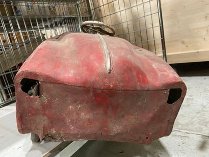 Pedal car in red painted sheet metal.
43...
