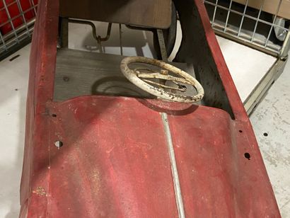 Pedal car in red painted sheet metal.
43...
