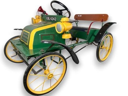 TRIANG.
Pedal car in green and yellow lacquered...