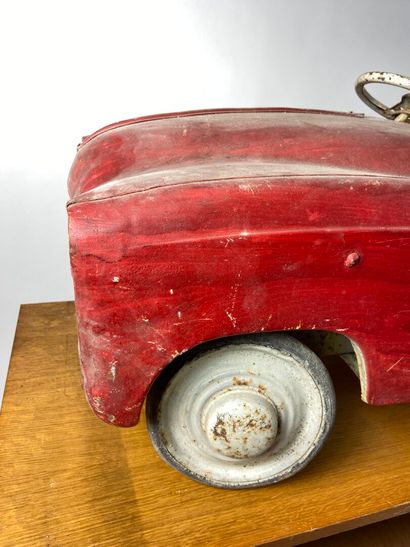 Pedal car in red painted sheet metal.
43...