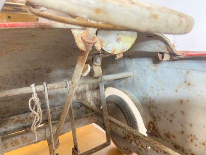 Pedal car in red painted sheet metal.
43...