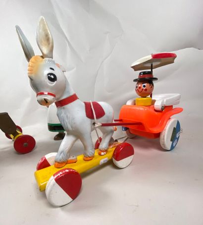 Two rolling pull-along toys:
- Donald and...