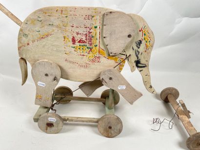 Polychrome wooden elephant on push-out wheels.
Articulation...