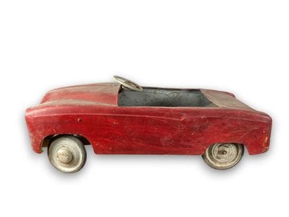 Pedal car in red painted sheet metal.
43...