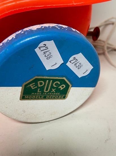 Two rolling pull-along toys:
- Donald and...