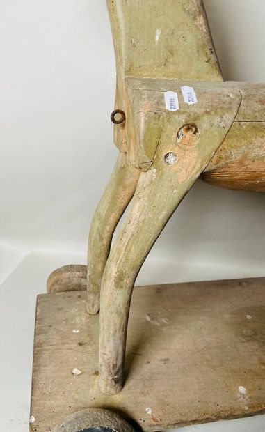 Horse on wheeled platform.
Old traces of...