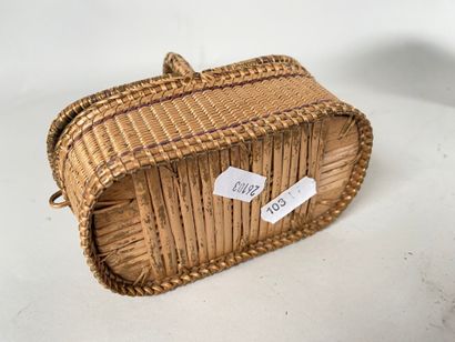 Four wicker picnic baskets with handles and...