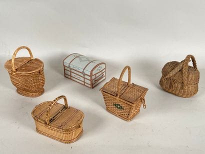 Four wicker picnic baskets with handles and...