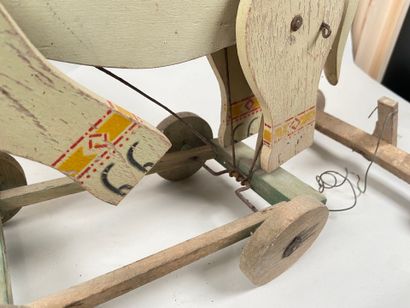 Polychrome wooden elephant on push-out wheels.
Articulation...