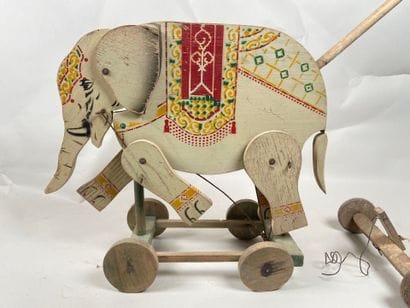 Polychrome wooden elephant on push-out wheels.
Articulation...