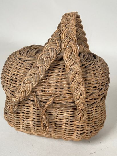 Four wicker picnic baskets with handles and...