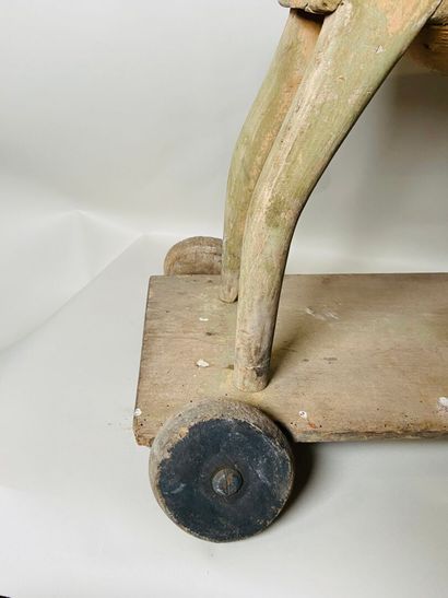 Horse on wheeled platform.
Old traces of...