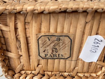 Four wicker picnic baskets with handles and...