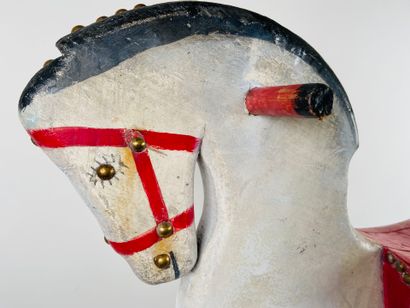 Polychrome wooden horse on wheels.
74 x 74...