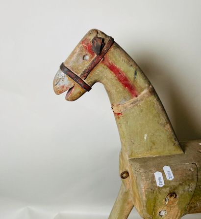 Horse on wheeled platform.
Old traces of...