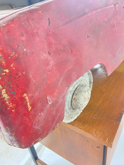 Pedal car in red painted sheet metal.
43...