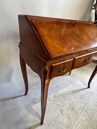 Wood and veneer sloping desk opening with...