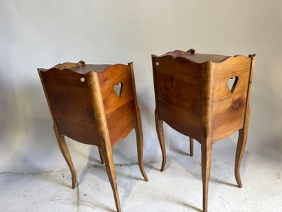 Pair of molded wood bedside tables with a...