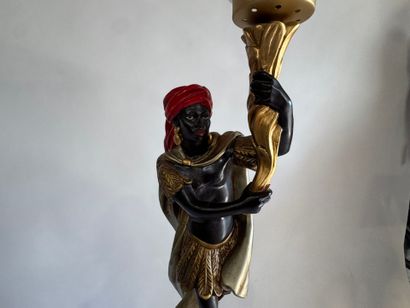 Nubian on saddle in polychrome resin, with...