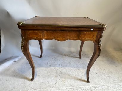 Wooden game table with cubes and foliate...