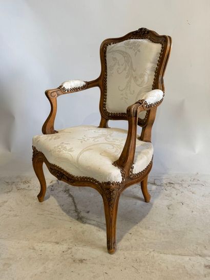 Wooden child's armchair, white silk studded...