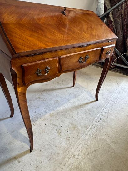 Wood and veneer sloping desk opening with...