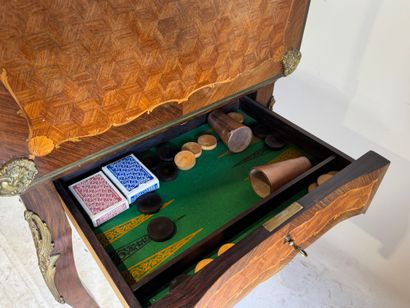 Wooden game table with cubes and foliate...