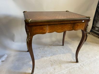 Wooden game table with cubes and foliate...