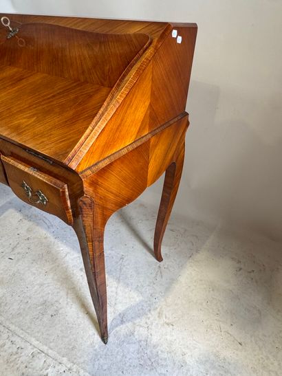 Wood and veneer sloping desk opening with...