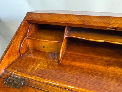 Wood and veneer sloping desk opening with...