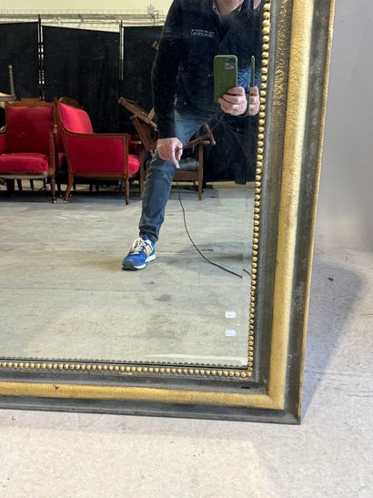 Large beveled mantelpiece mirror in gilded...
