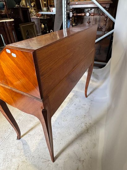 Wood and veneer sloping desk opening with...