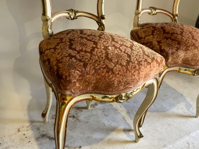 Pair of molded wood, polychrome and gold...