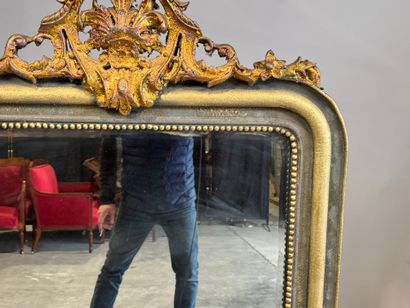 Large beveled mantelpiece mirror in gilded...