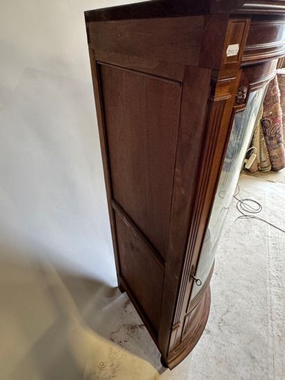 Corner display case opening with a door,...