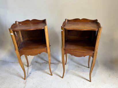 Pair of molded wood bedside tables with a...