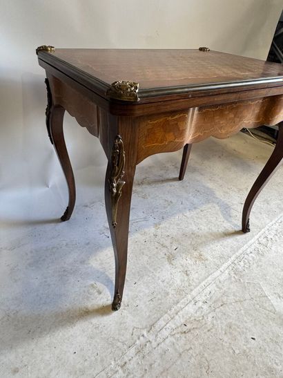 Wooden game table with cubes and foliate...