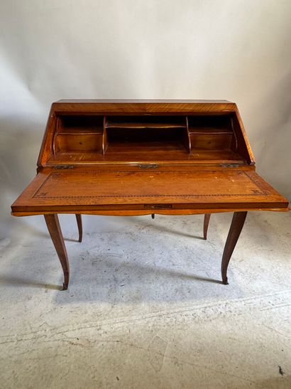 Wood and veneer sloping desk opening with...