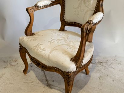Wooden child's armchair, white silk studded...