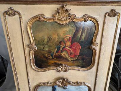 Trumeau in molded, carved, gilded and beige...