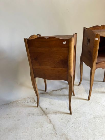 Pair of molded wood bedside tables with a...