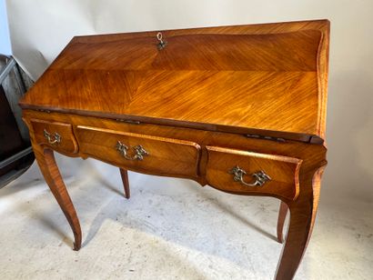 Wood and veneer sloping desk opening with...