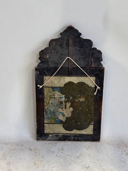 Embossed brass mirror with foliate scrolls.
58...
