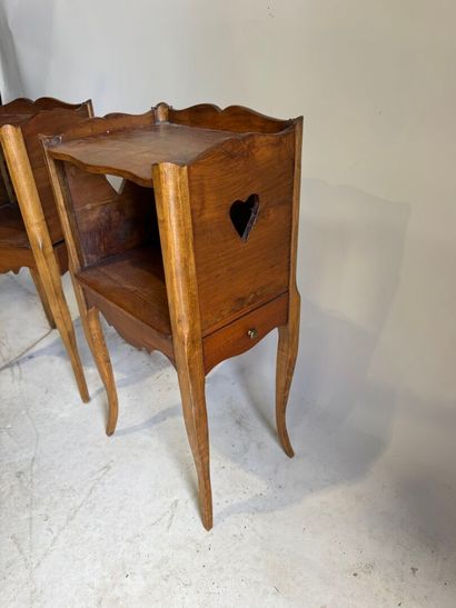 Pair of molded wood bedside tables with a...